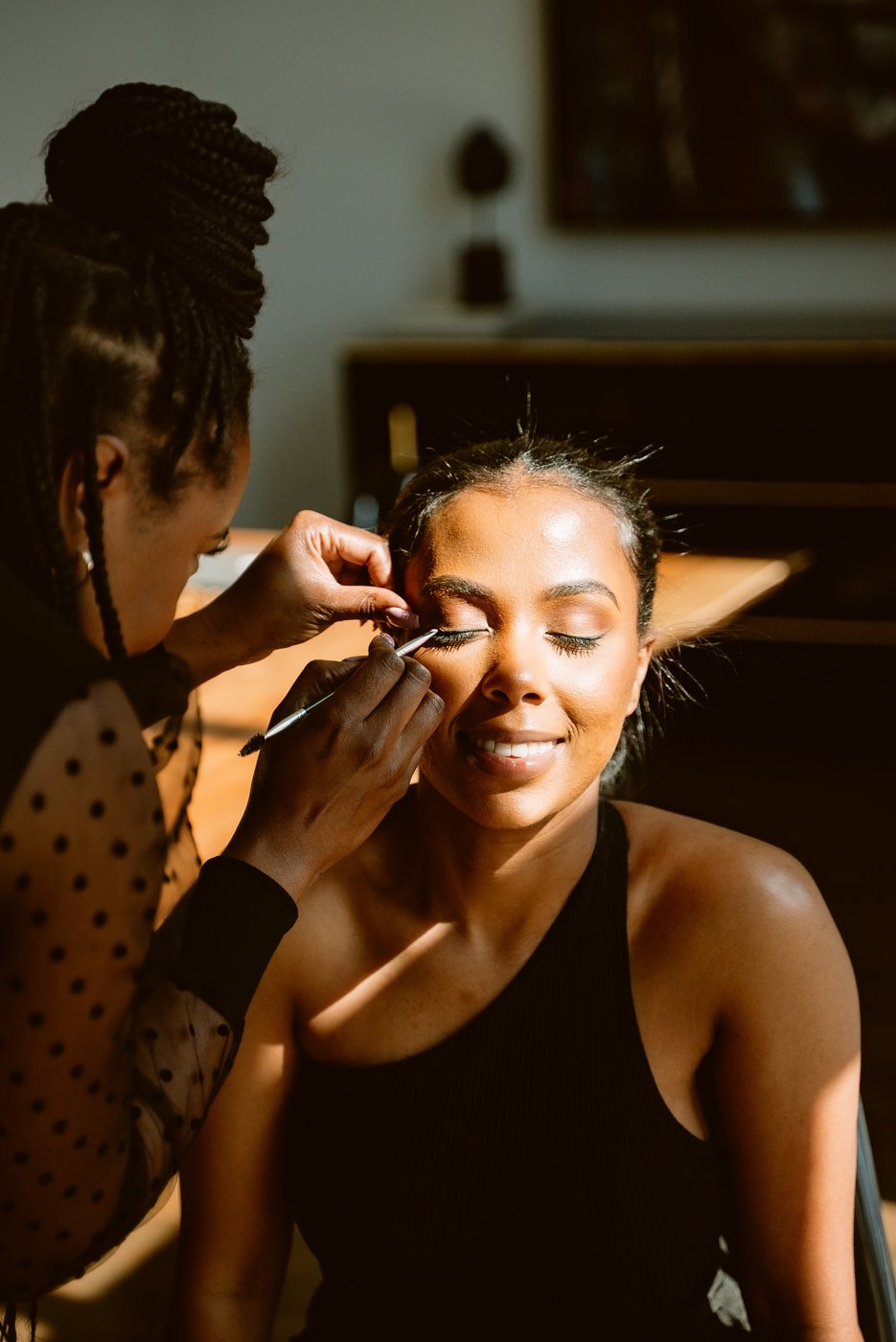 Sia Mia applying makeup on set