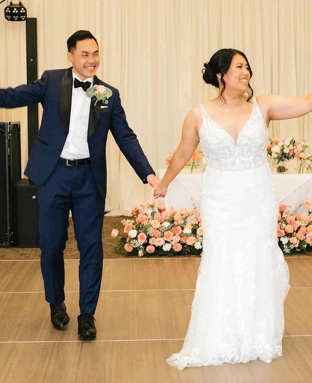 Bride and groom reception entrance — makeup and hair by Sia Mia