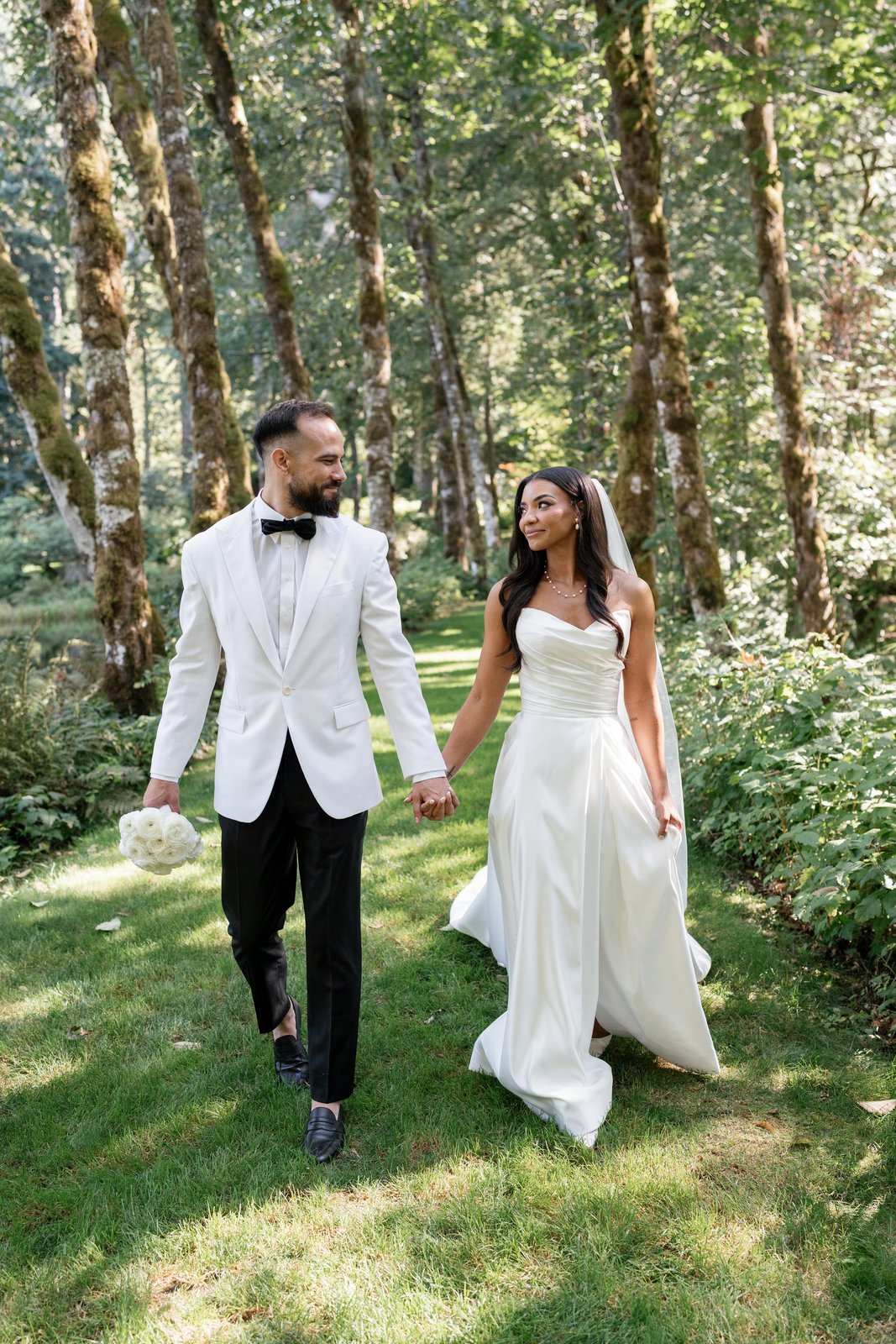 Bride and groom walking hand in hand — bridal beauty by Sia Mia