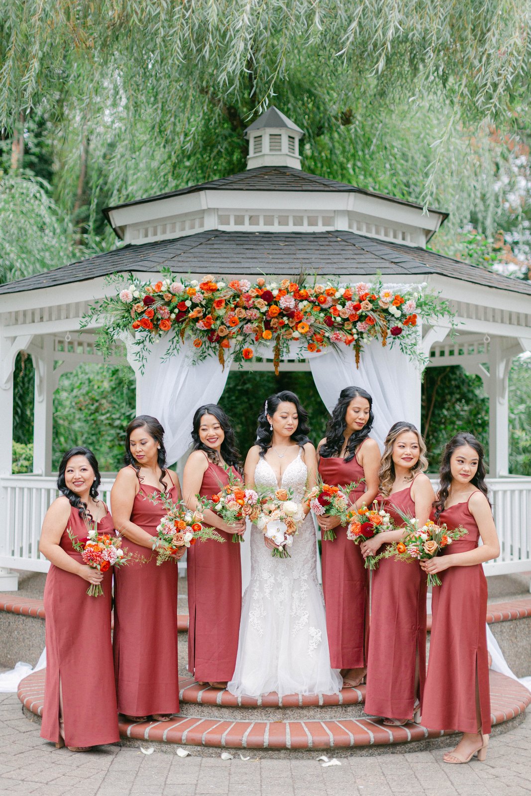 Bridesmaids and bride at gazebo — bridal party makeup by Sia Mia