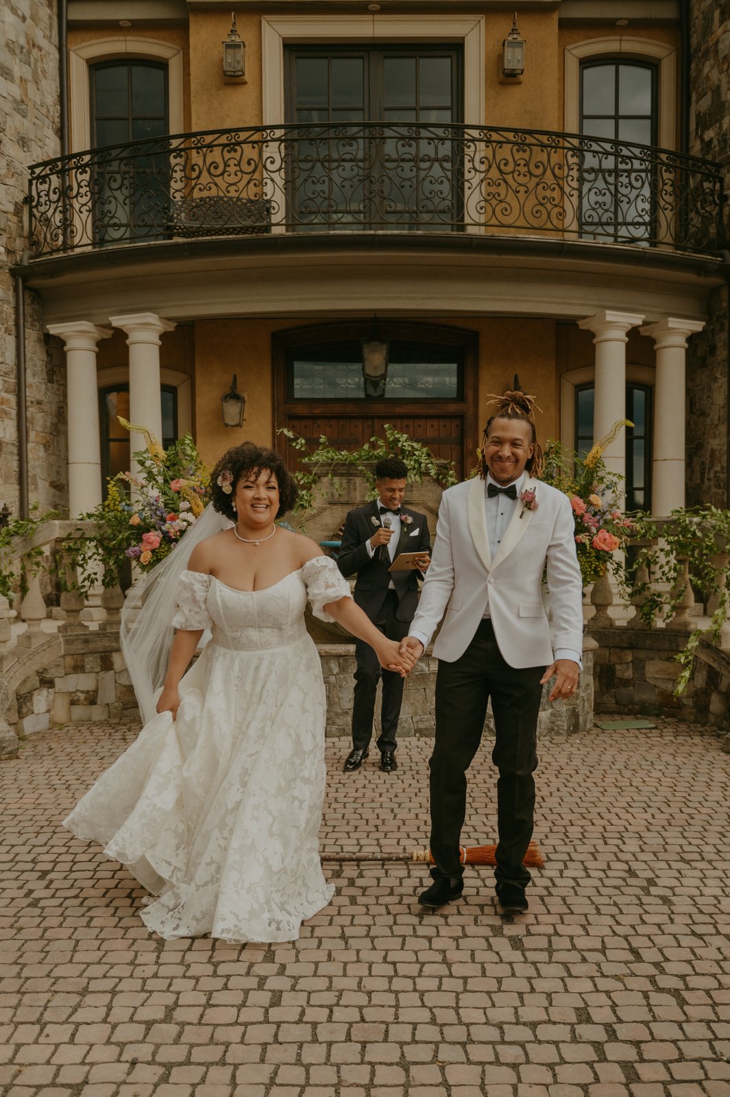 Wedding couple at the venue — bridal makeup and hair by Sia Mia