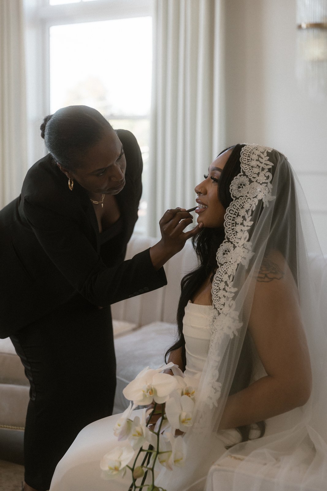 Sia Mia applying bridal makeup on a wedding day